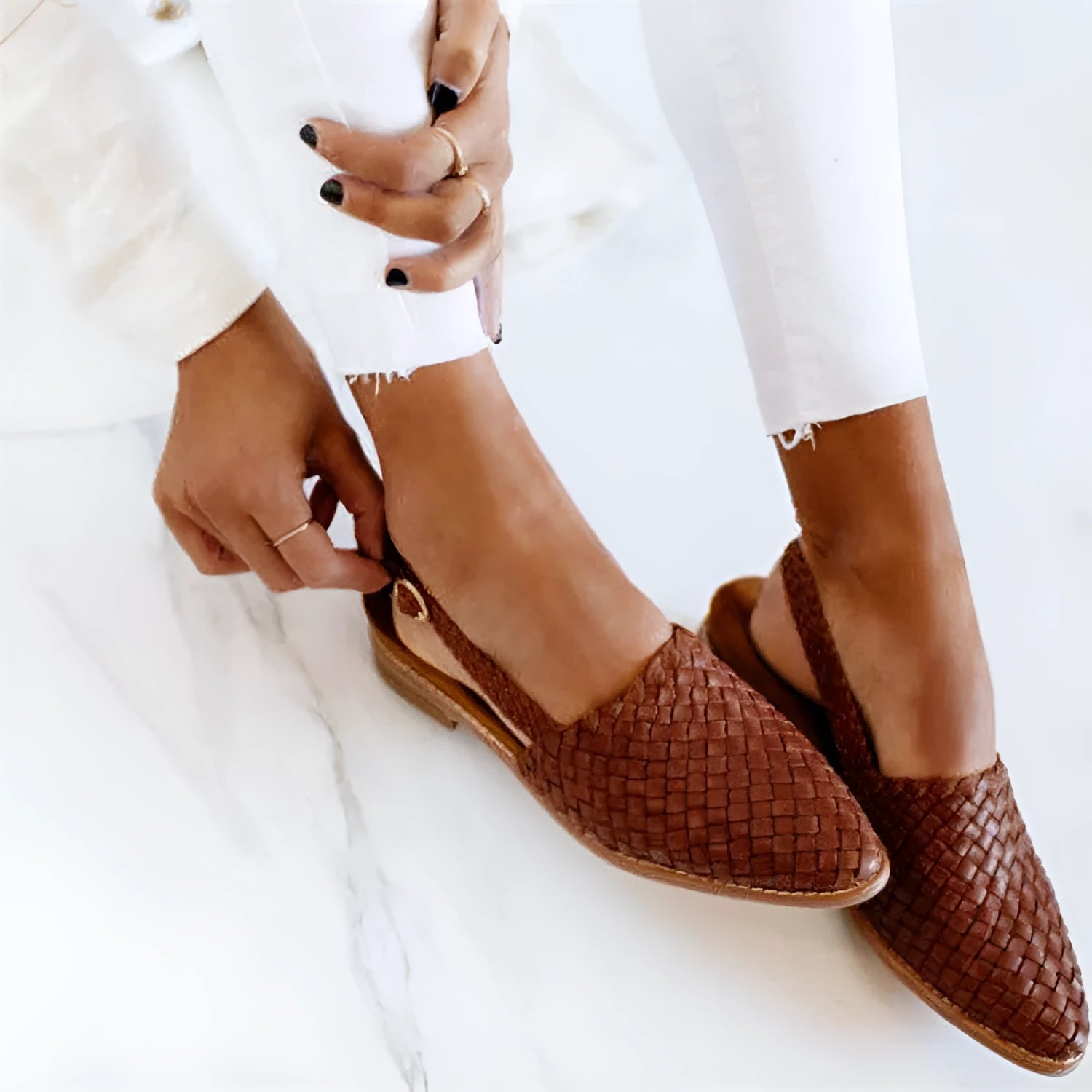 Women's buckle flat sandals with pointed toe in multiple colour options showing adjustable strap
