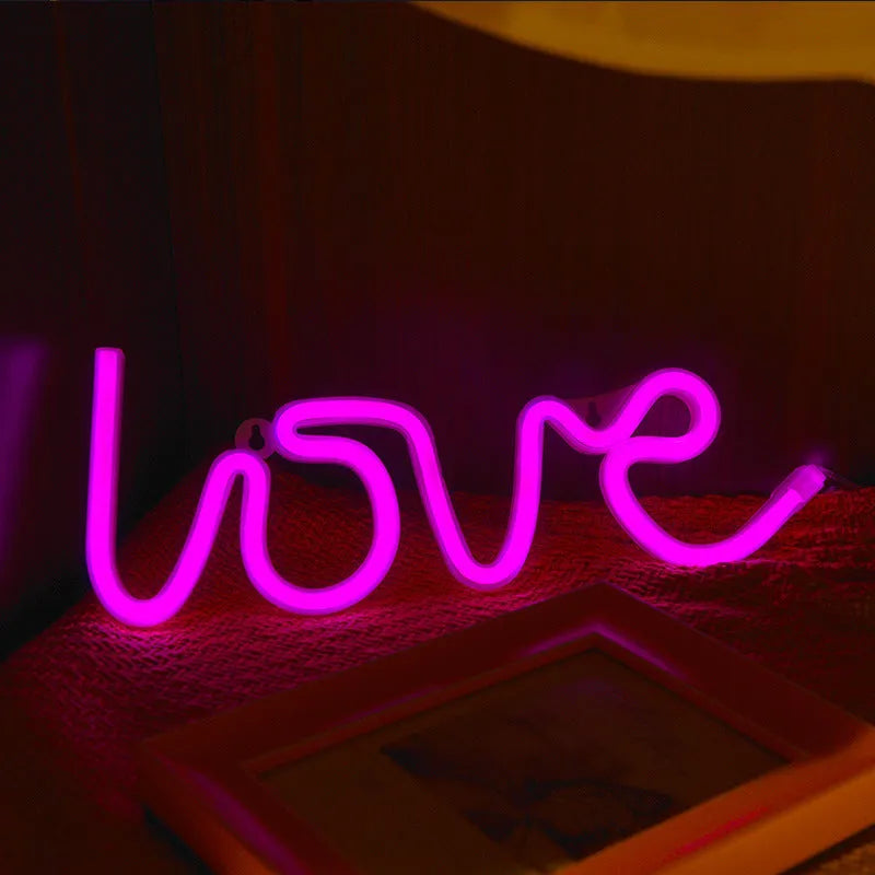Pink love-shaped LED neon sign light with USB and battery power options for indoor decoration