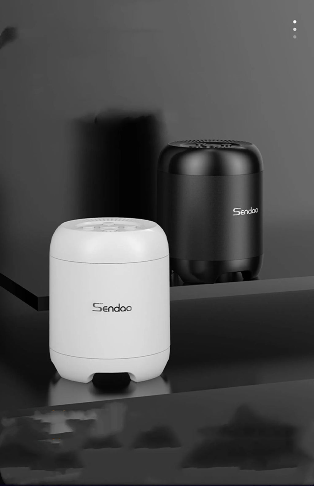 Compact black or white Bluetooth speaker with card reader slot and subwoofer grille