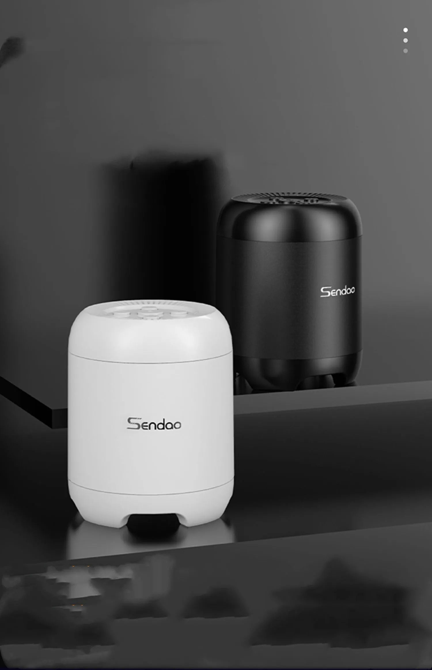 Compact black or white Bluetooth speaker with card reader slot and subwoofer grille