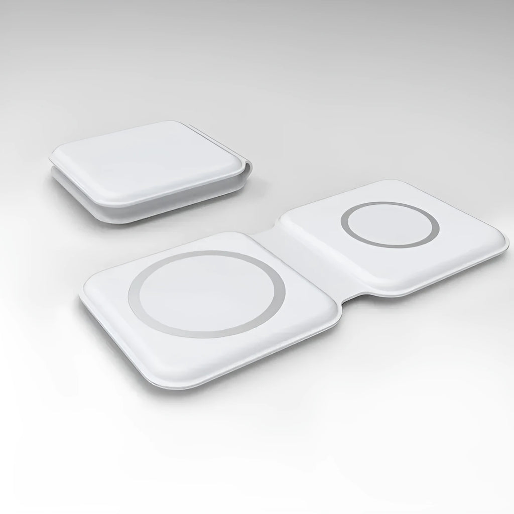 White foldable magnetic wireless charger charging two phones simultaneously on angled stand