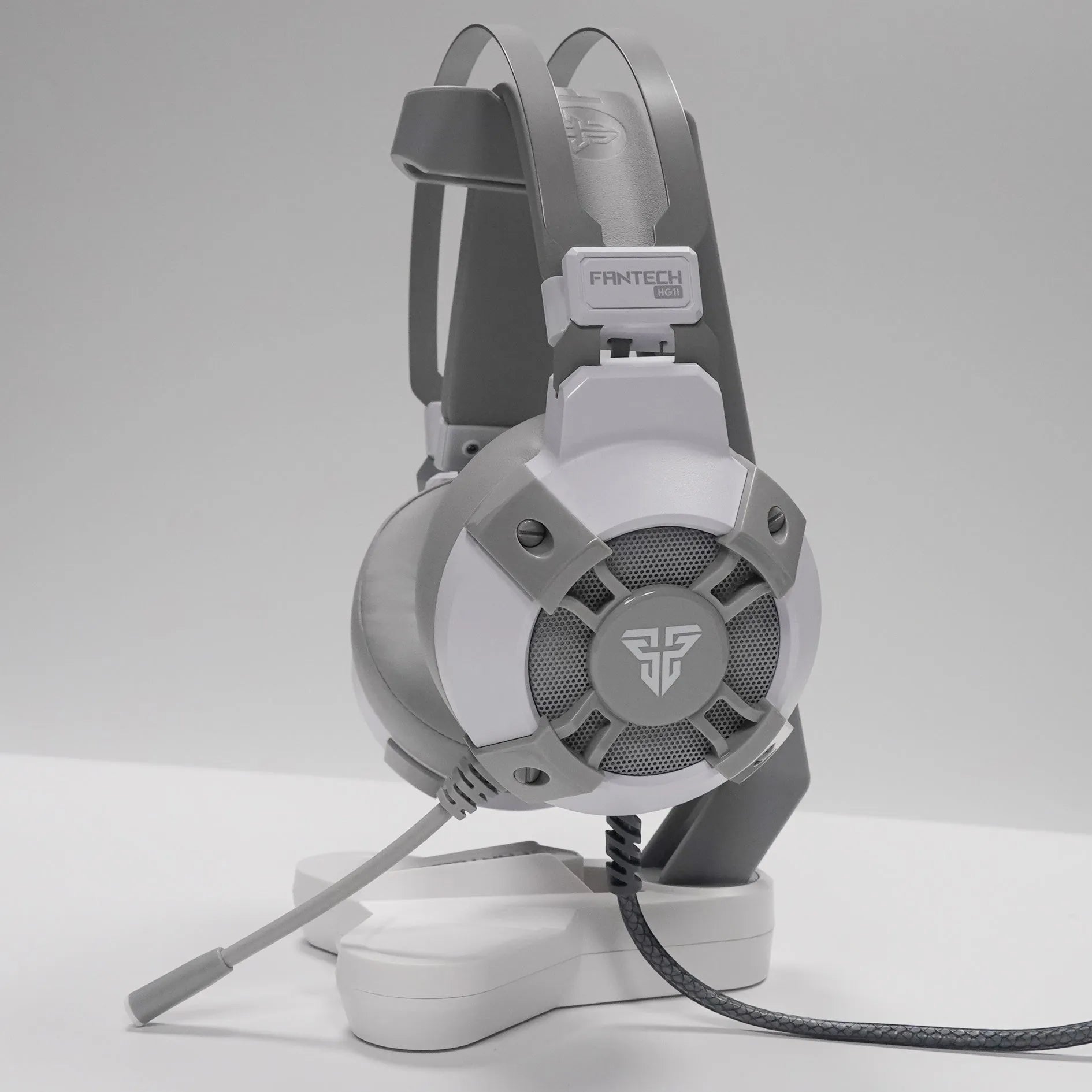 Black FANTECH HG11 gaming headset with RGB lights on the ear cups.
