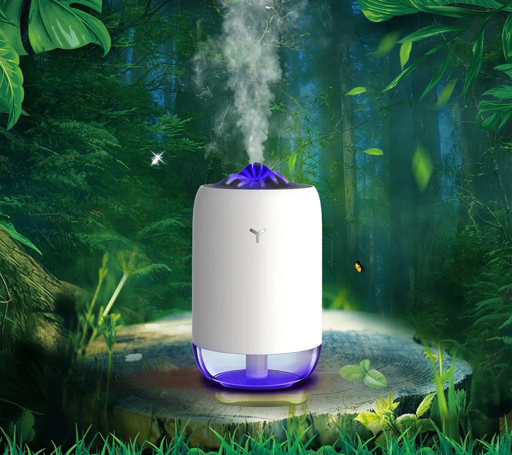 Mini columnar ultrasonic humidifier with magic flame light effect in white, blue, and pink colour options.