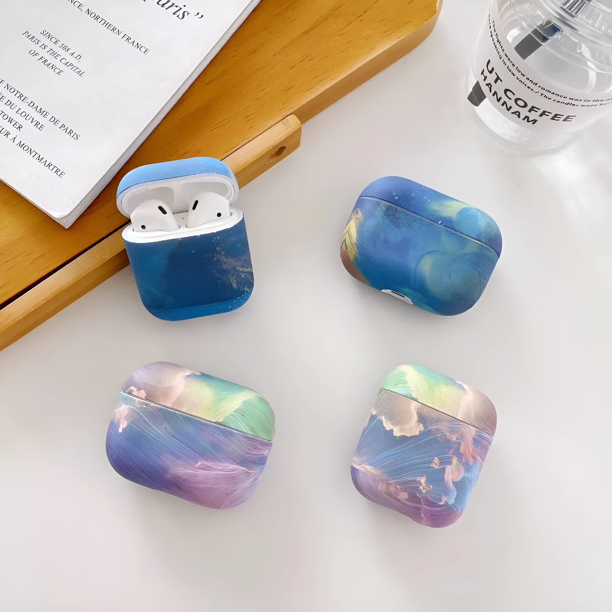 Pink and blue watercolour design hard plastic protective case for Apple AirPods Pro, AirPods 1, and AirPods 2.