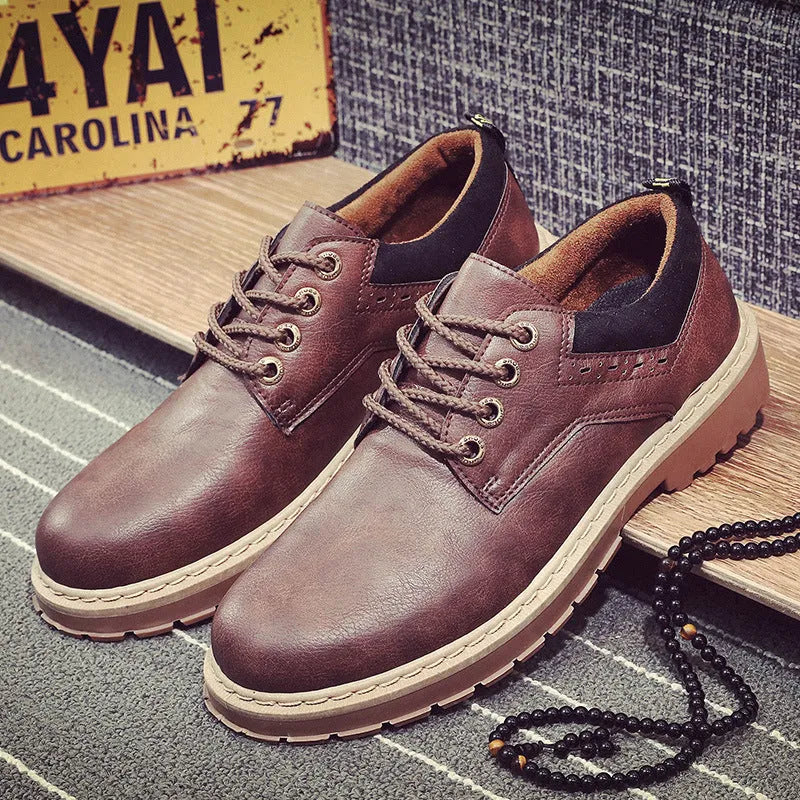 Men's black casual shoes with round toe and rubber soles showing front-tie design