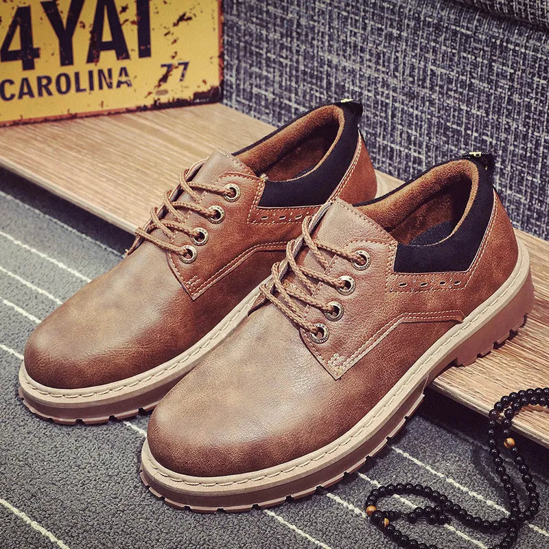 Men's black casual shoes with round toe and rubber soles showing front-tie design