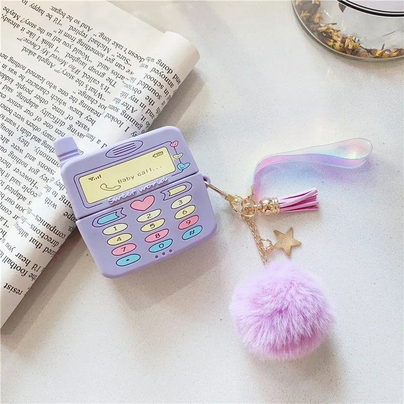 Purple silicone clamshell AirPods case with fur ball pendant for Apple wireless headphones