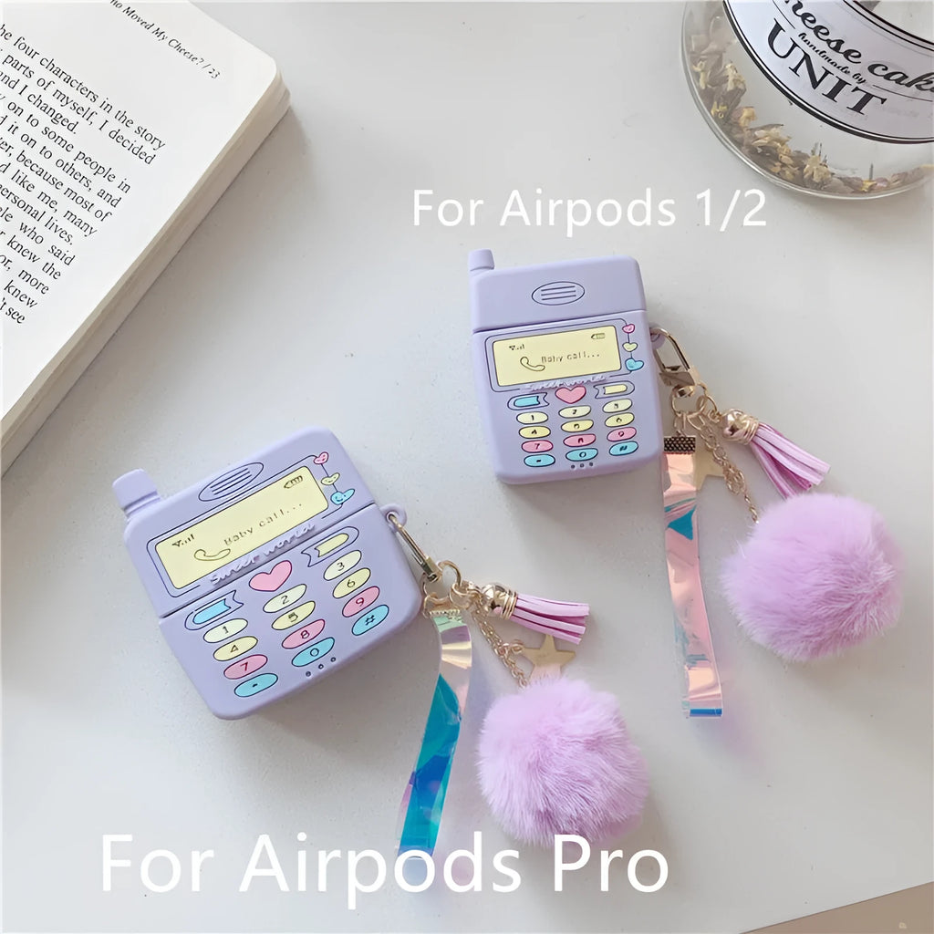 Purple silicone clamshell AirPods case with fur ball pendant for Apple wireless headphones