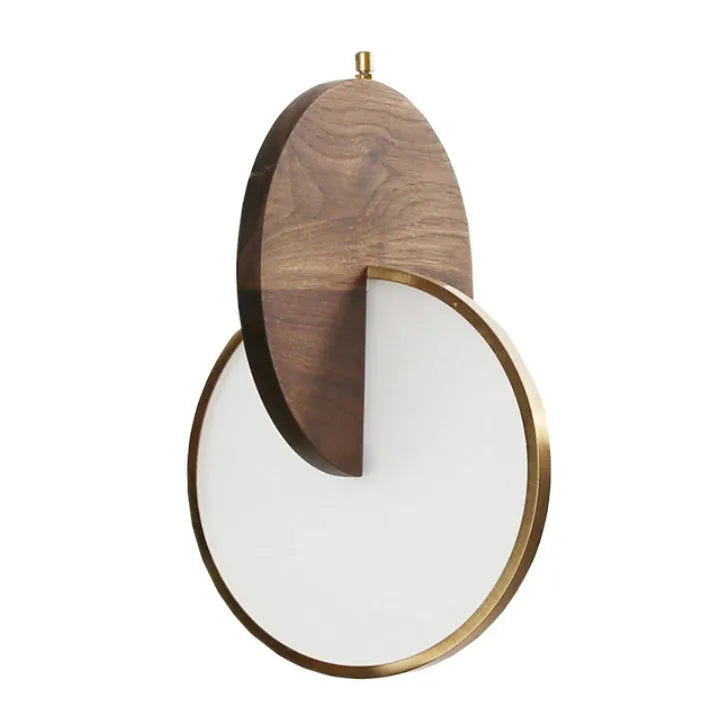 Long-line carved walnut wood wall chandelier emitting warm white light in a modern room setting.