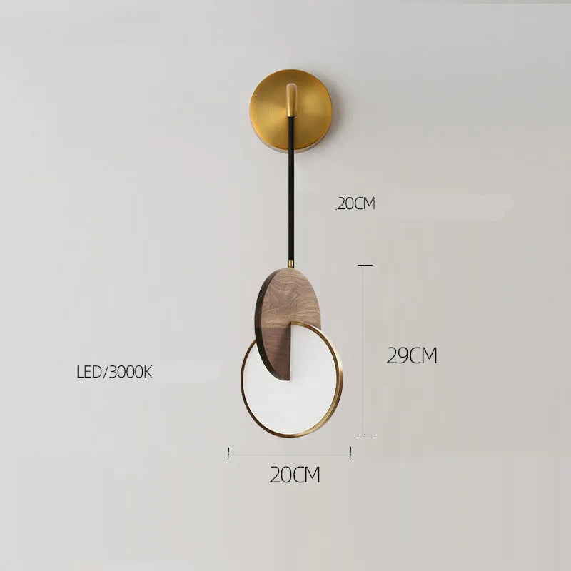 Long-line carved walnut wood wall chandelier emitting warm white light in a modern room setting.