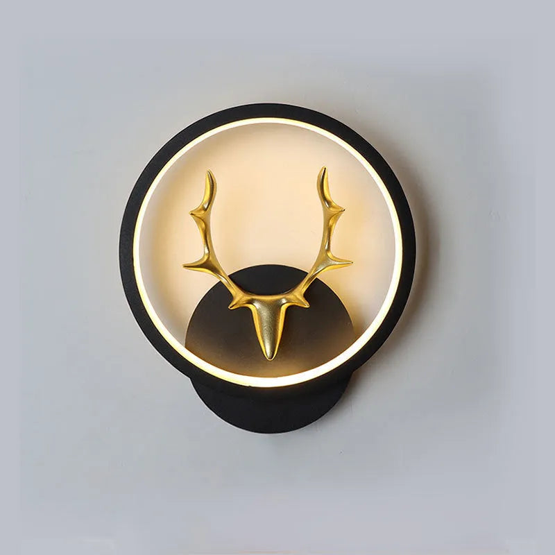Deer antler shaped wall lamp with remote control on a white wall, showing Nordic design.
