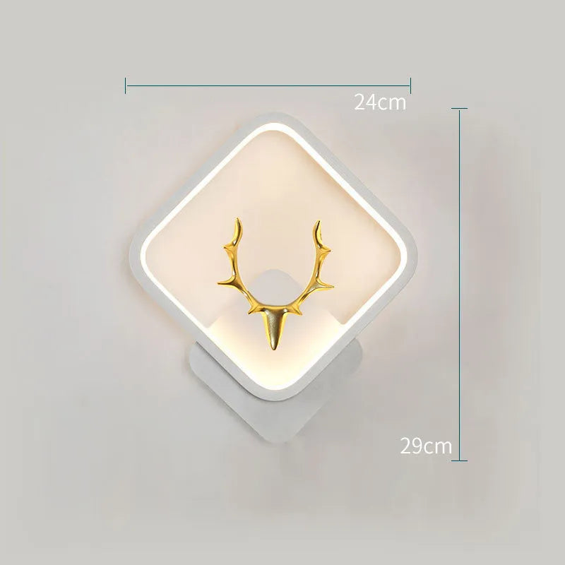 Deer antler shaped wall lamp with remote control on a white wall, showing Nordic design.