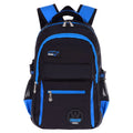 Green waterproof nylon school bag for students with multiple compartments on a white background.