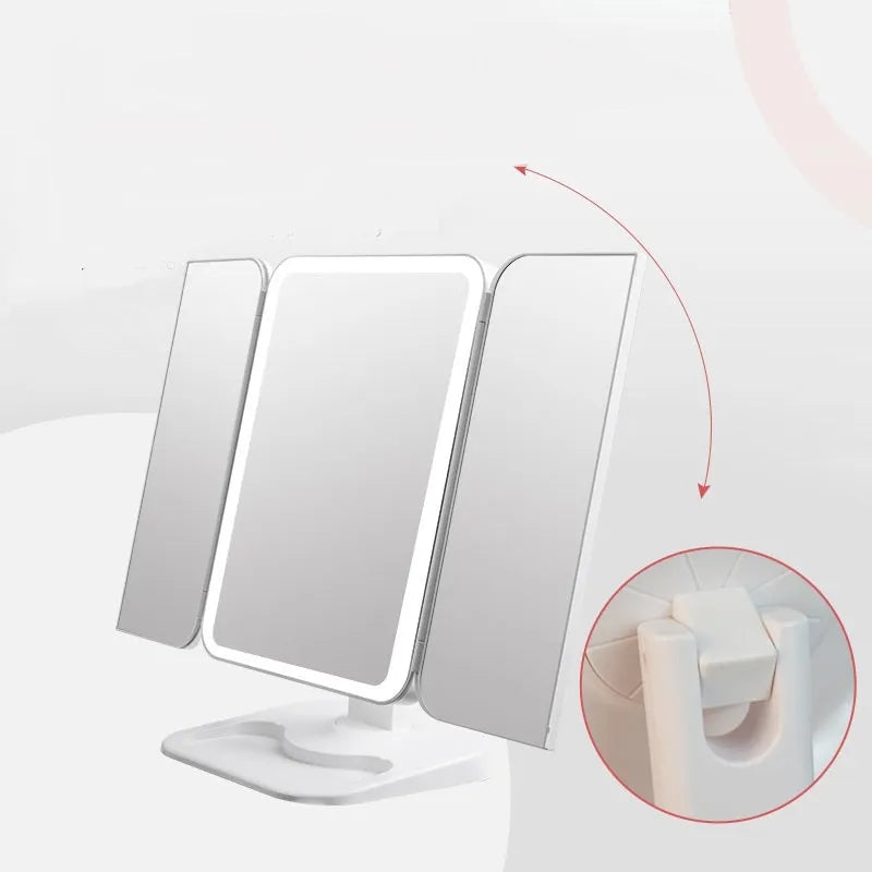 Trifold LED makeup mirror with 68 lights, 10X magnifying mirror, and USB rechargeable battery on table