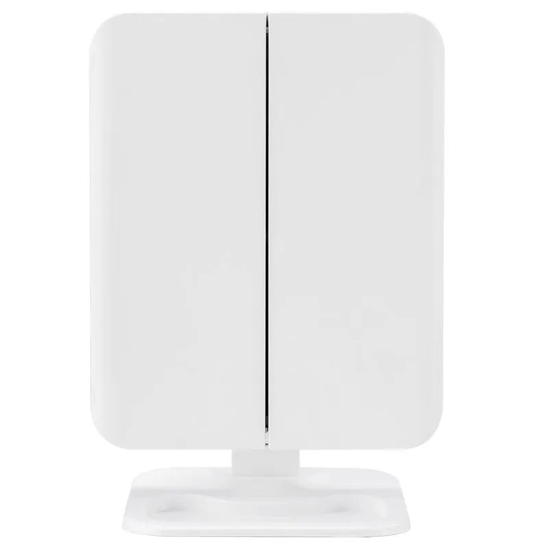 Trifold LED makeup mirror with 68 lights, 10X magnifying mirror, and USB rechargeable battery on table