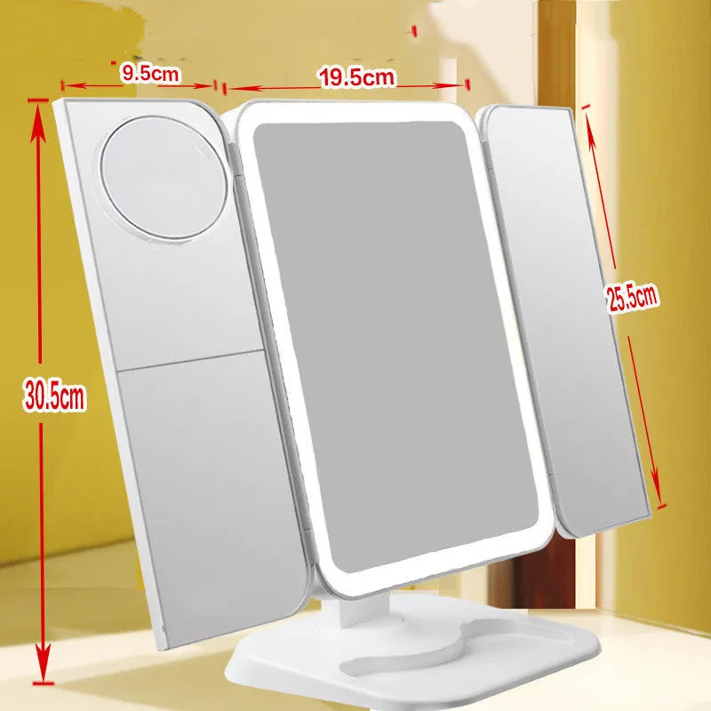 Trifold LED makeup mirror with 68 lights, 10X magnifying mirror, and USB rechargeable battery on table