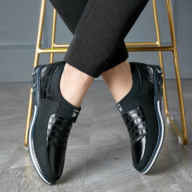Men's black casual leather low-top shoes showing side profile on a white background.