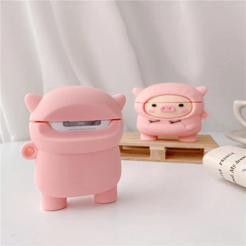 Pink silicone AirPods case with cartoon pig design, flip opening, and hook attachment