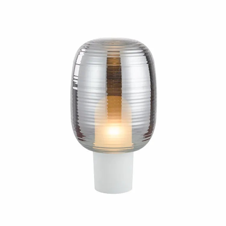Simple modern Nordic style glass table lamp with a cognac coloured shade and push button switch.