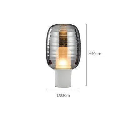Simple modern Nordic style glass table lamp with a cognac coloured shade and push button switch.
