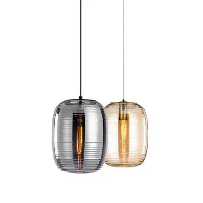 Simple modern Nordic style glass table lamp with a cognac coloured shade and push button switch.
