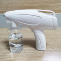 White handheld cordless electric spray disinfection gun with USB charging cable