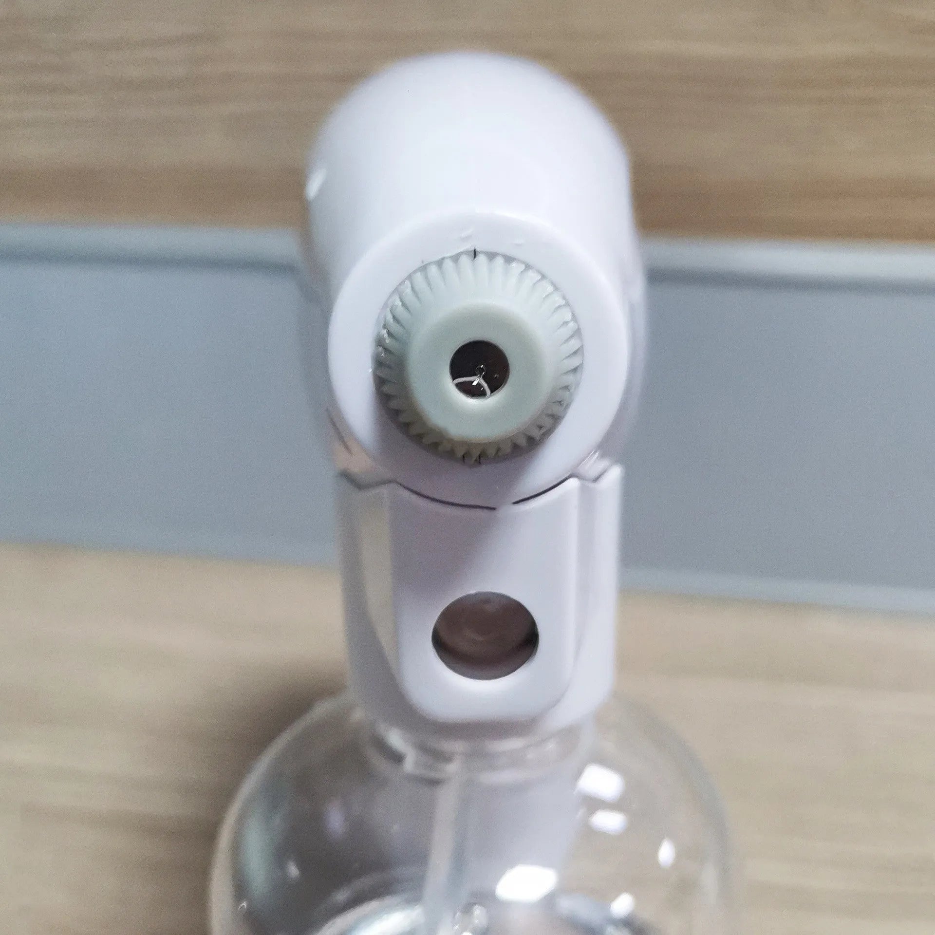 White handheld cordless electric spray disinfection gun with USB charging cable