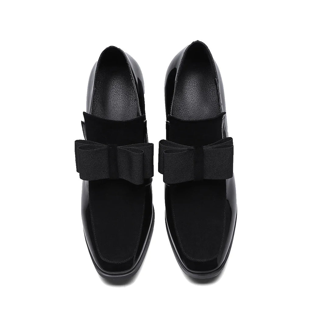 Black patent leather women's high heels with a thick square heel and rubber sole.