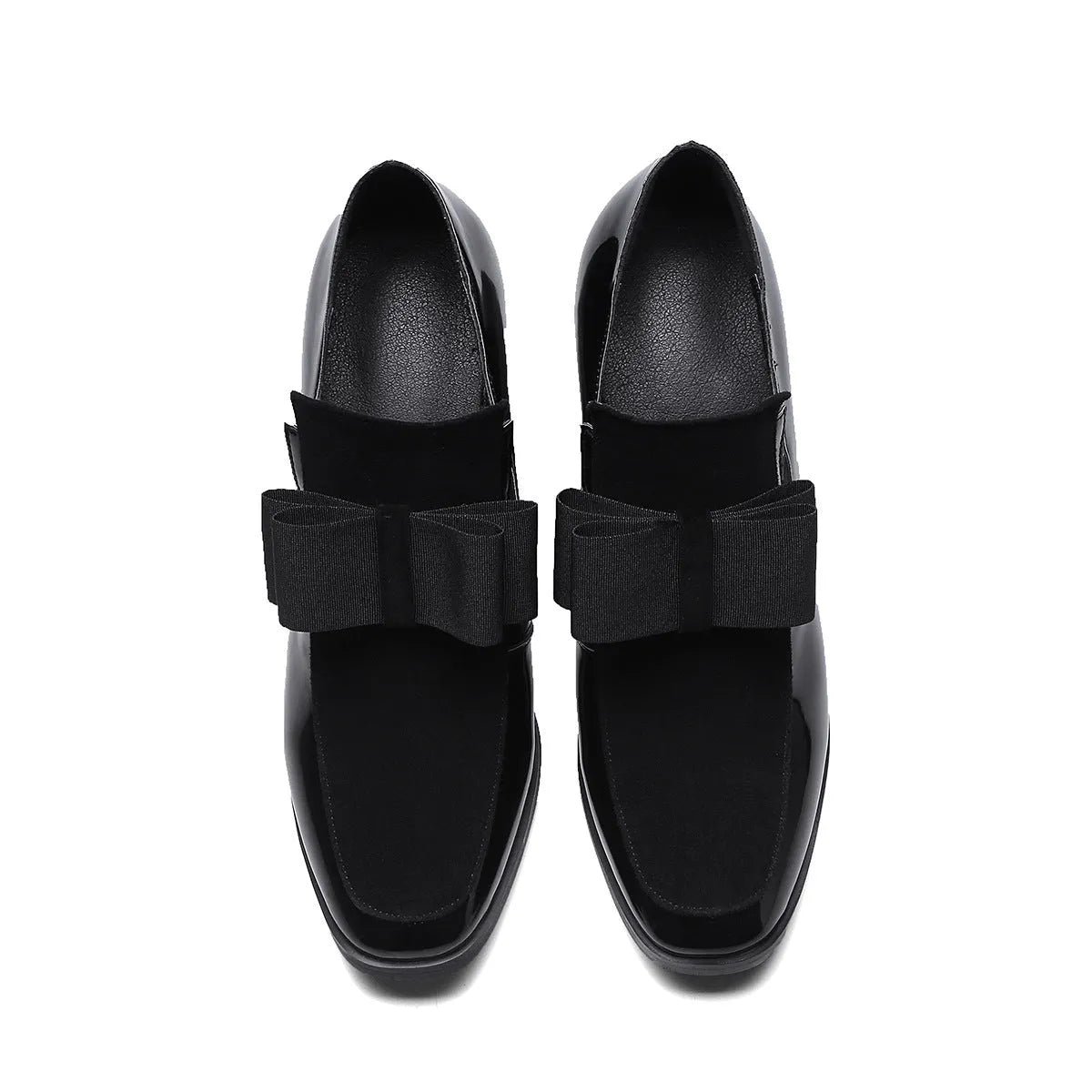 Black patent leather women's high heels with a thick square heel and rubber sole.