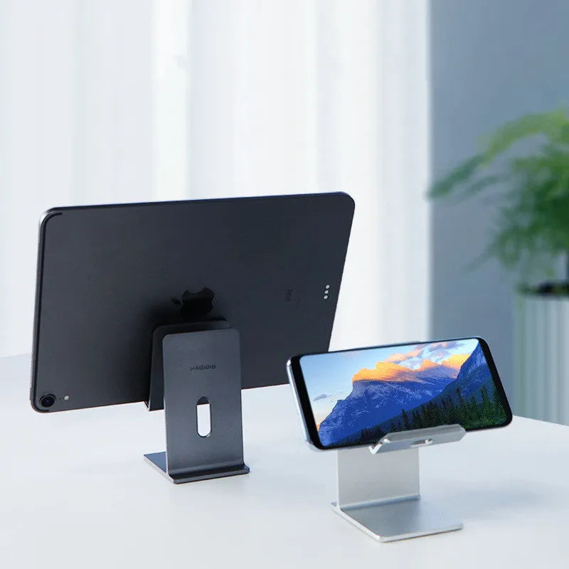 Dark gray alloy desktop stand holding a mobile phone at an angle