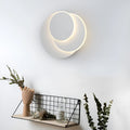 Modern round acrylic wall lamp in black or white, shown in small, medium, and large size options.
