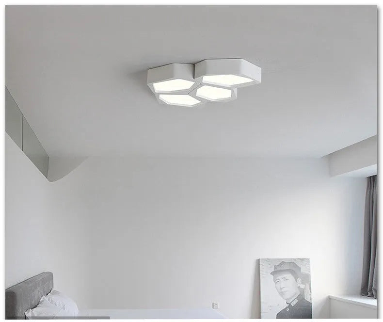 Geometric shaped LED ceiling light with iron shade in black or white frame options