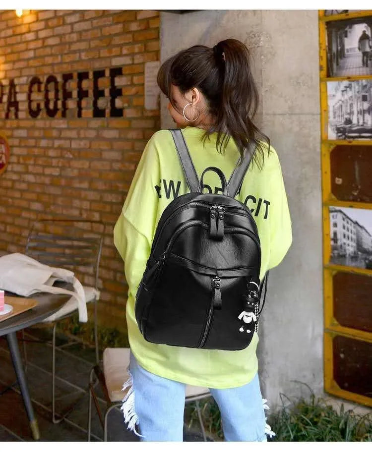 Black PU leather backpack with double straps showing ID compartment organisation