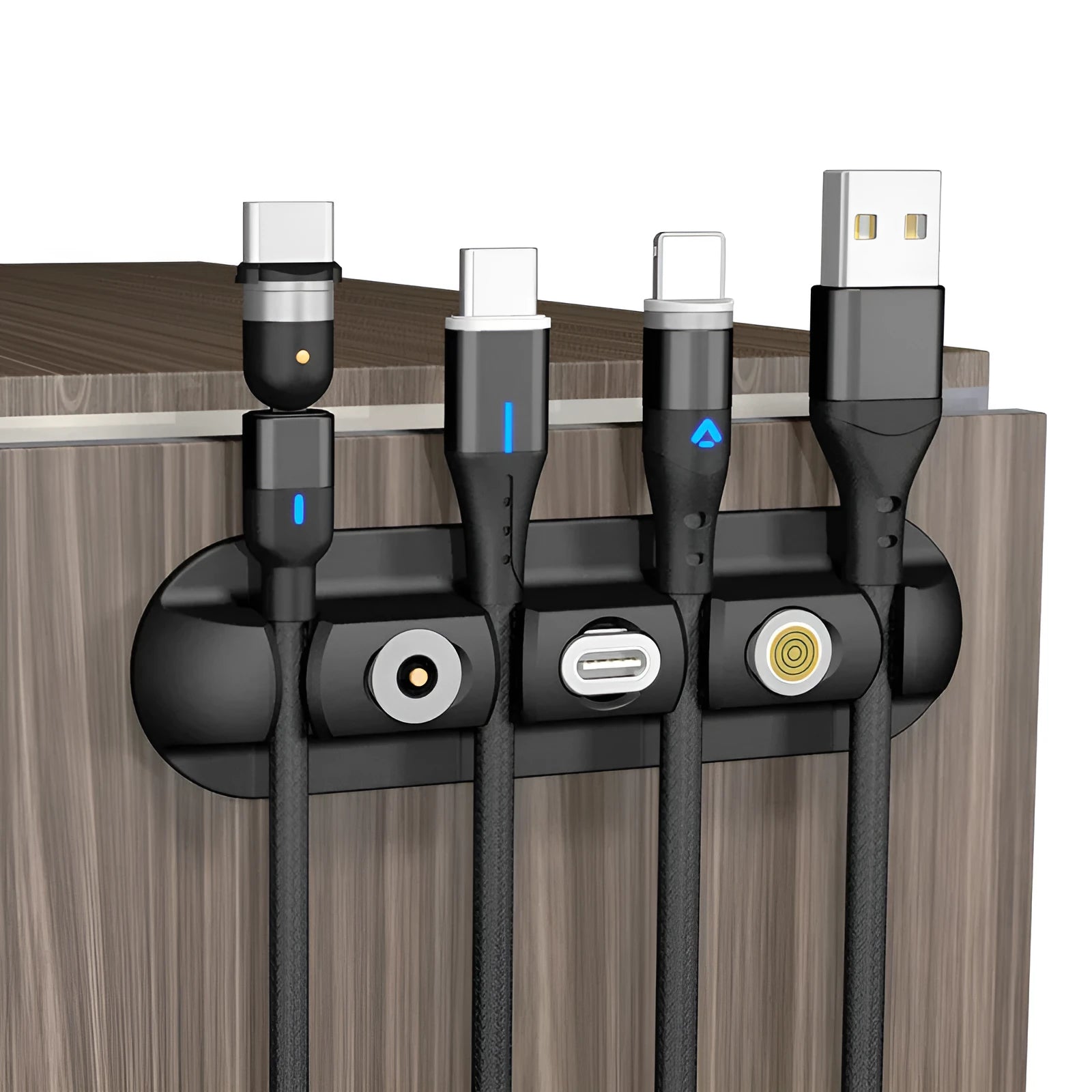 Black soft plastic magnetic cable organiser for desktop charging cable storage.