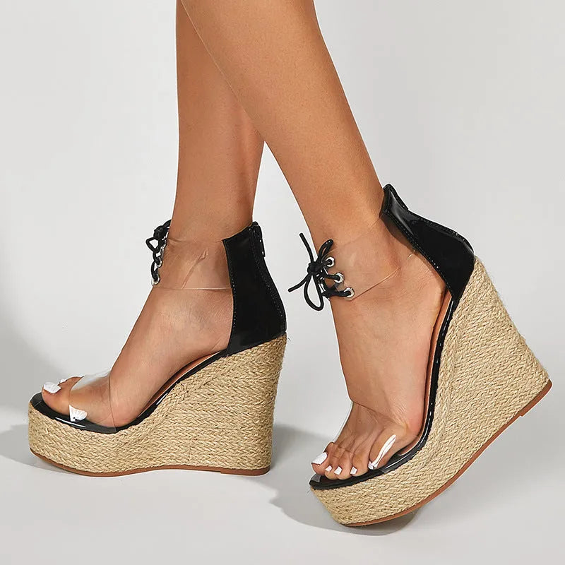 Black women's wedge sandals with hemp rope detail, super high wedge heel, and front tie closure.
