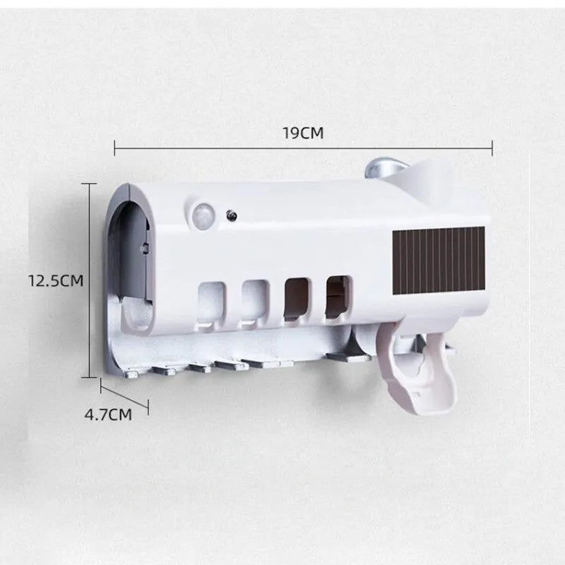 Black smart UV toothbrush steriliser and automatic toothpaste squeezer mounted on a bathroom wall.