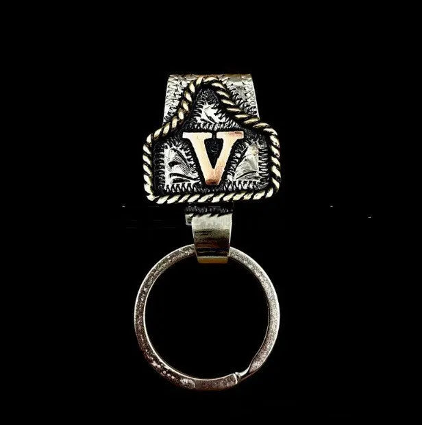 Handmade metal cow tag key holder for belts in assorted colours on a leather strap