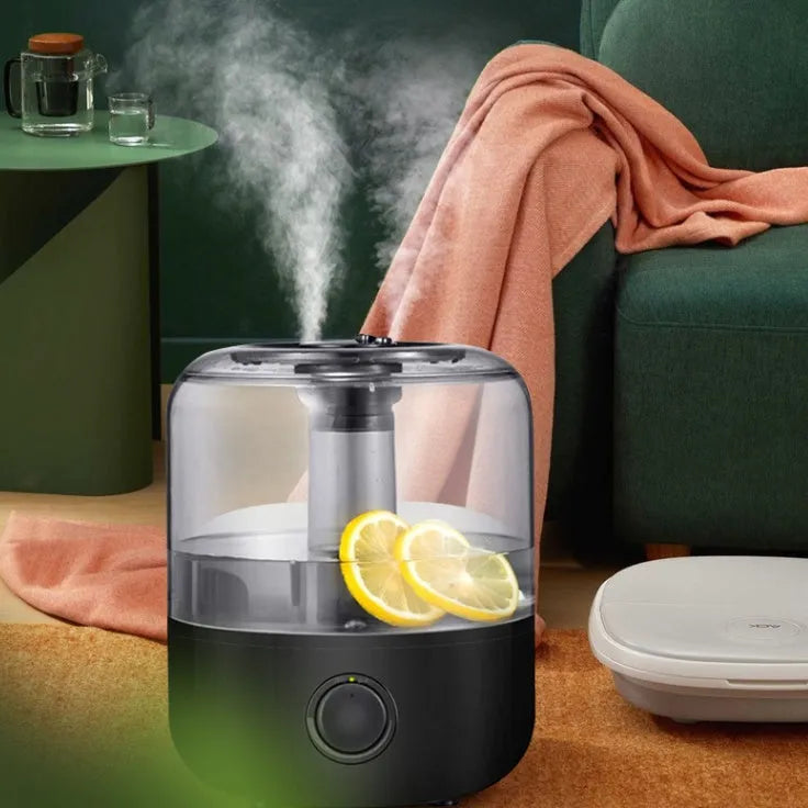 Black and white ultrasonic humidifier with 3 litre tank and aromatherapy function on bedside table