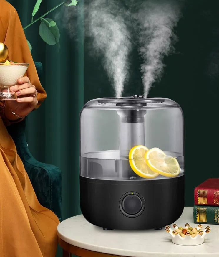 Black and white ultrasonic humidifier with 3 litre tank and aromatherapy function on bedside table
