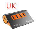 Dark grey and orange aluminium USB-C hub with four USB 3.1 ports, a DC power input, and a detachable cable.