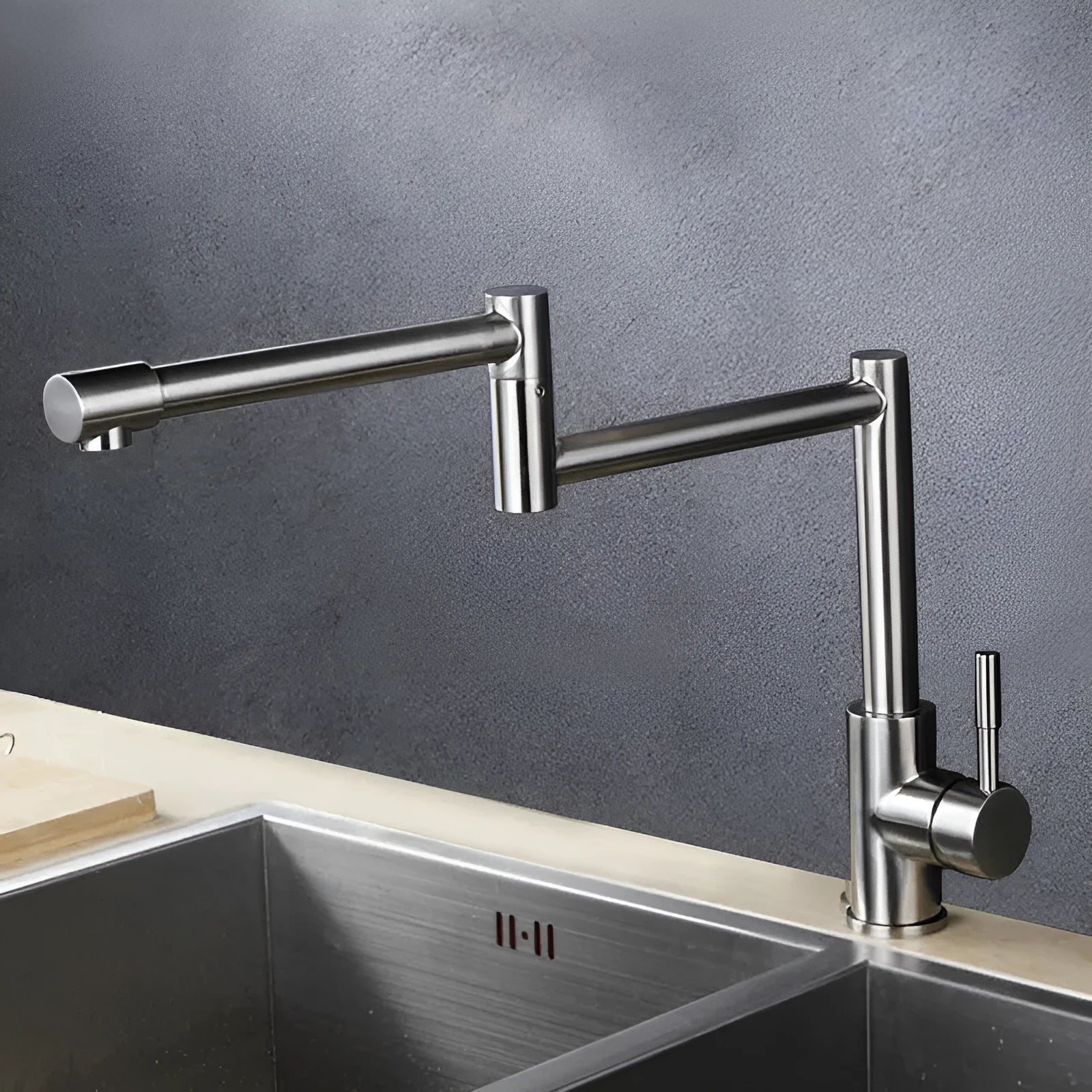 Silver stainless steel kitchen tap with 360-degree rotating spout and dual handles