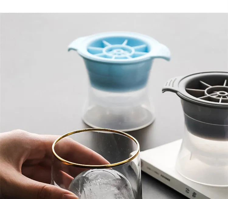 Silicone ice tray showing hockey puck shaped moulds alongside pentagon and spherical designs in light blue colour