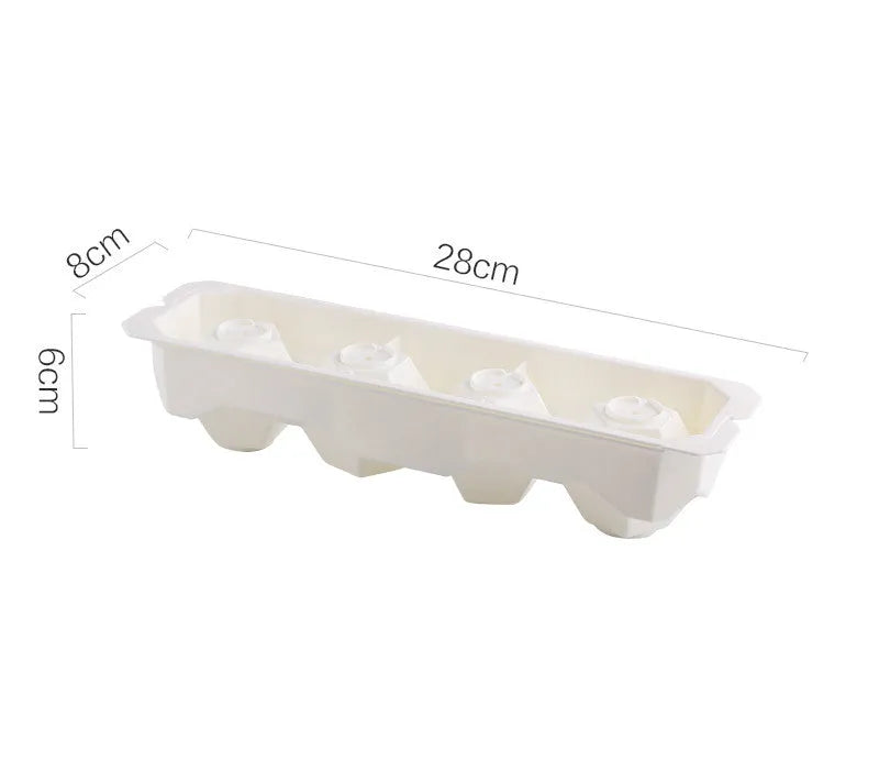 Silicone ice tray showing hockey puck shaped moulds alongside pentagon and spherical designs in light blue colour