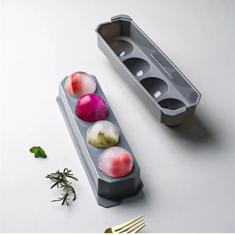 Silicone ice tray showing hockey puck shaped moulds alongside pentagon and spherical designs in light blue colour