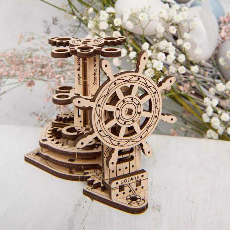 Ukrainian wooden rotating pen holder model showing steering wheel mechanism.