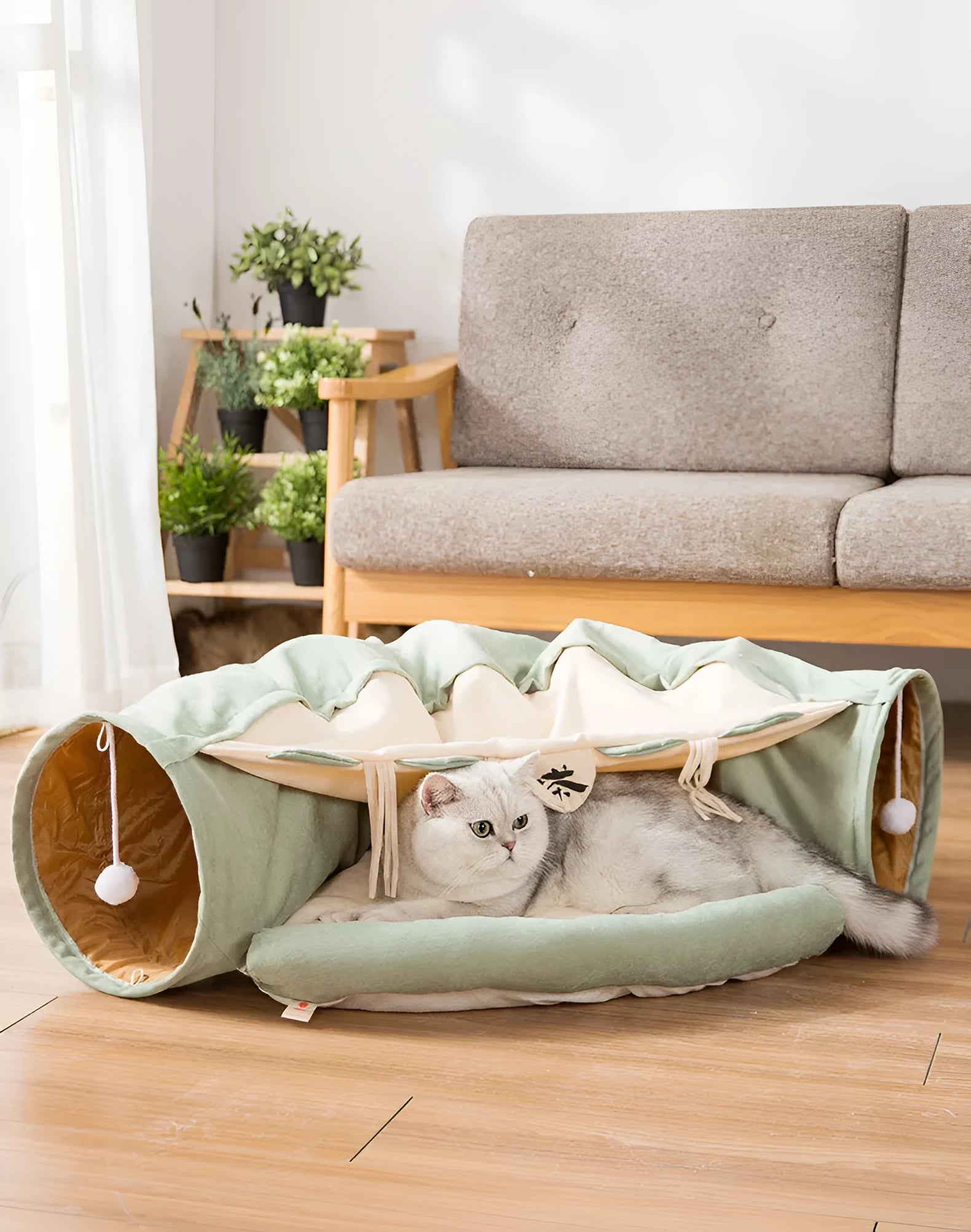 Collapsible cloth cat tunnel shown in a pop-up cylinder shape and folded flat, in a choice of colours.