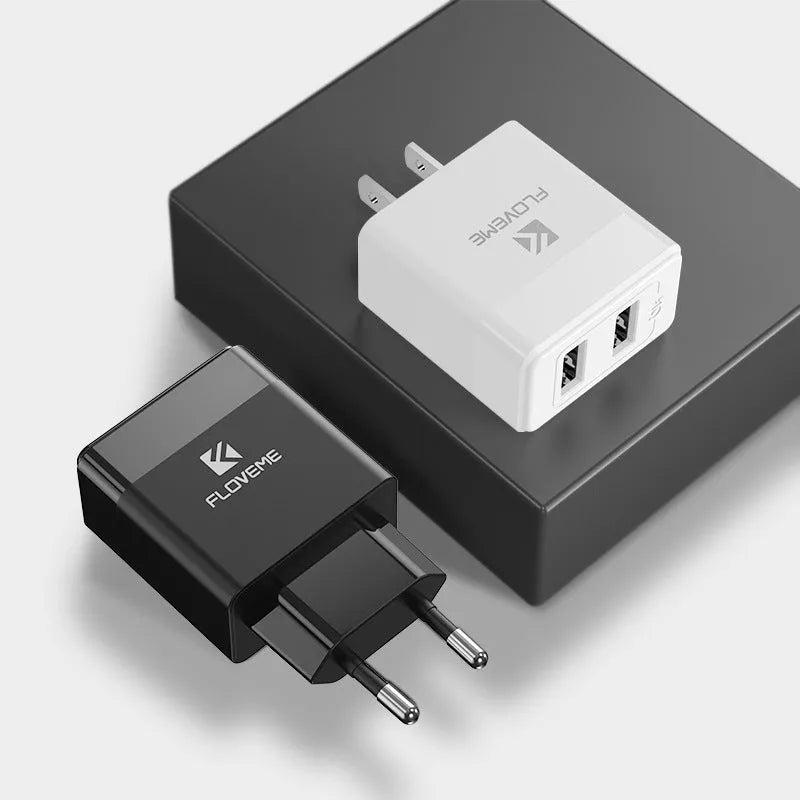 Black and white dual voltage travel charger with USB port for European and American standards