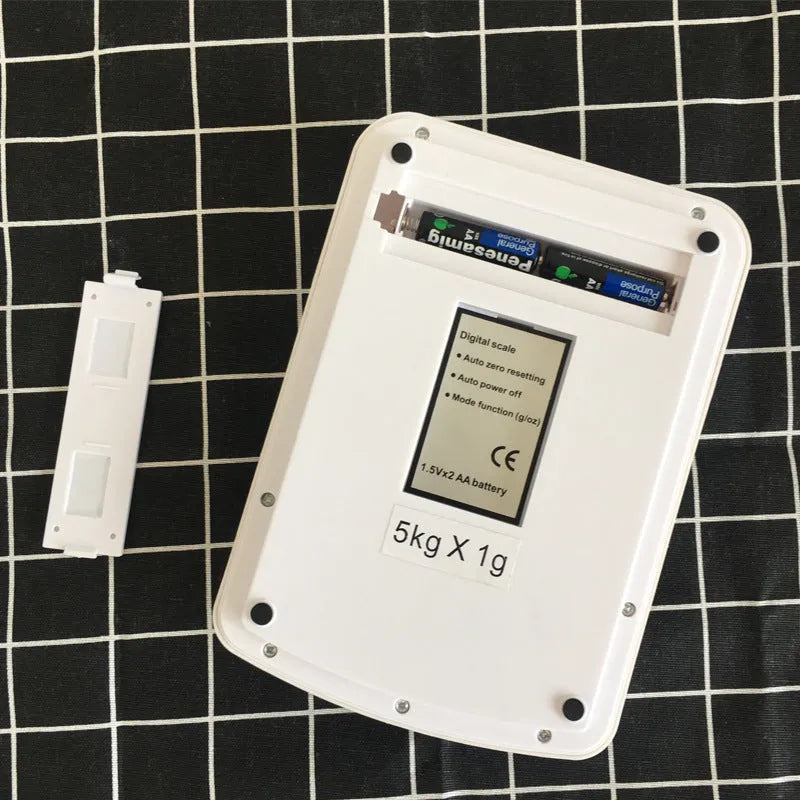SF-400A electronic kitchen scale with digital display, battery compartment, and weighing platform