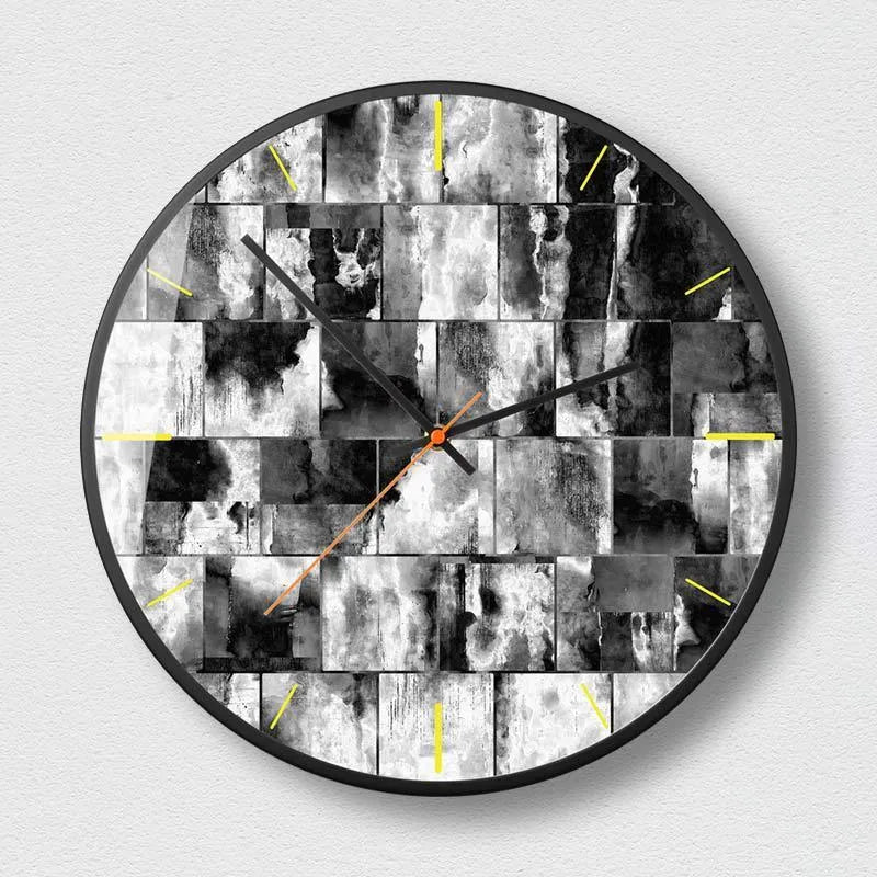 Round abstract art wall clock with metal frame in Mysterious Black, available in 12 inch and 14 inch sizes.