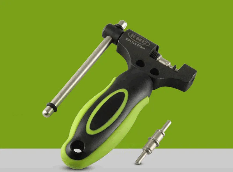 Green bicycle chain tool with double shaft chain breaker mechanism and replacement pins for 0-speed chains